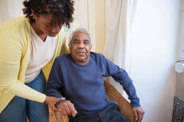 carer checking in an elderly patient in uyo