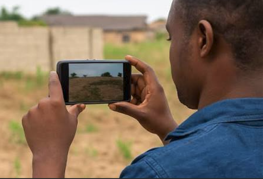 physical inspector taking pictures of a construction site in uyo